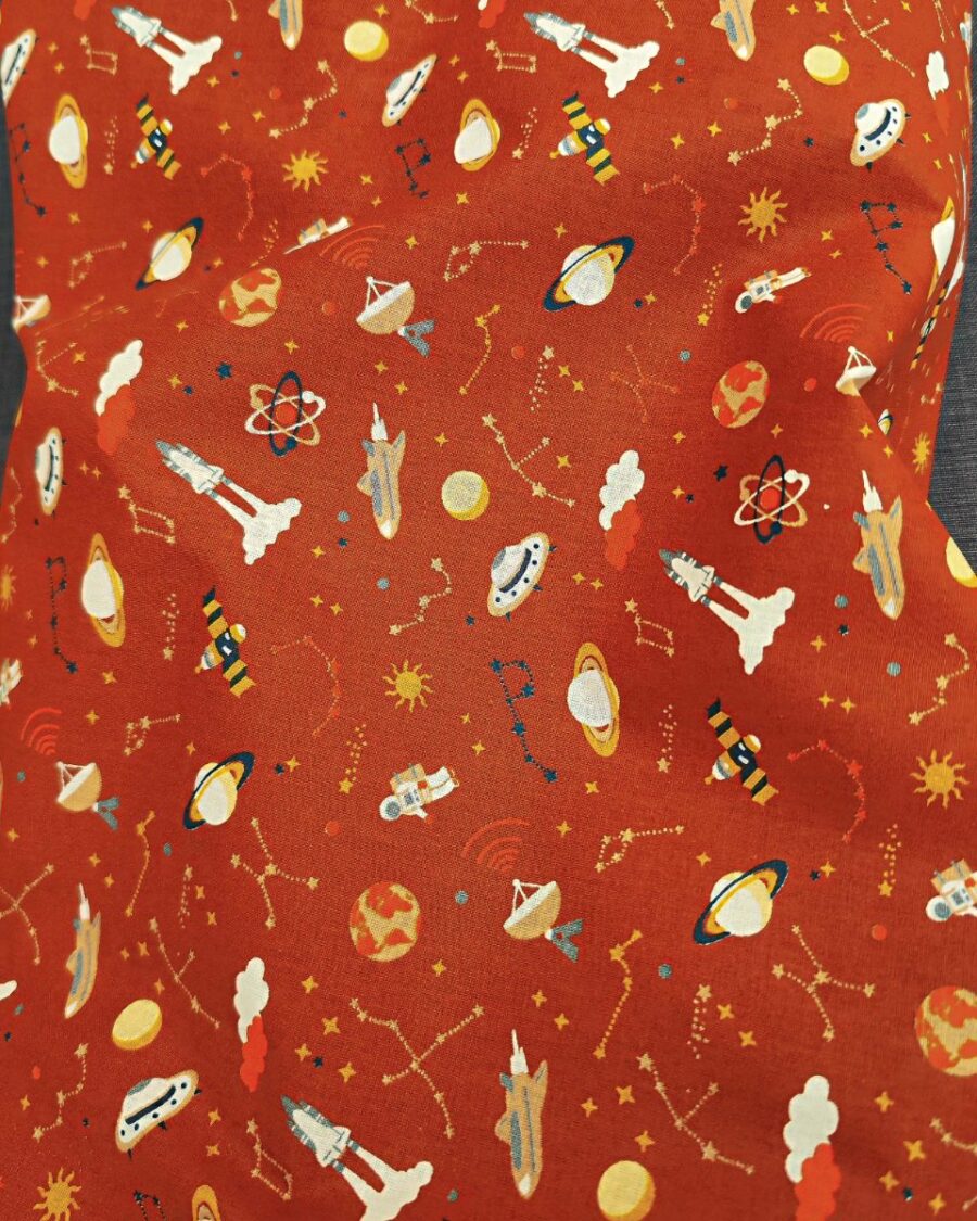 tissu coton astres planète et astronaute terracotta