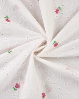 tissu broderie anglaise petite fleur fuchsia fond blanc